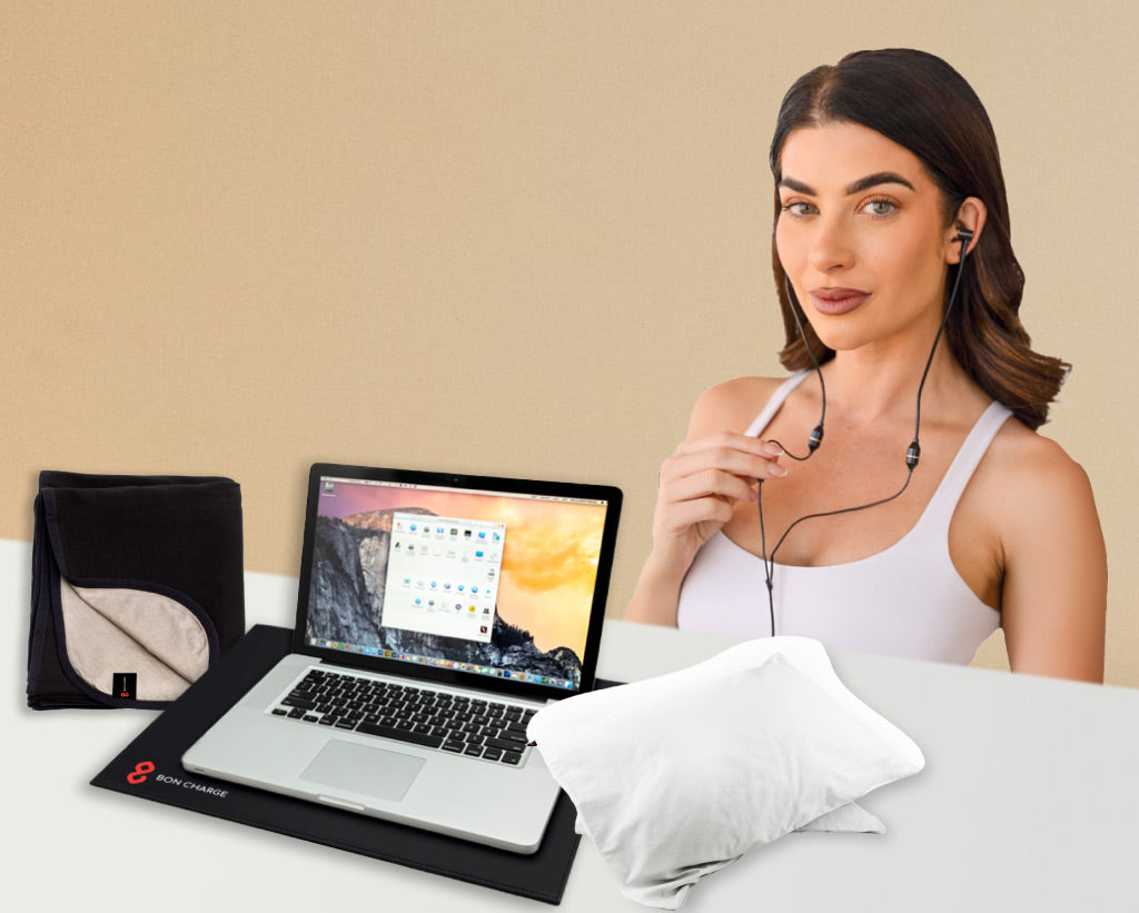 Woman Wearing Earphone Behind A Range Of EMF Products